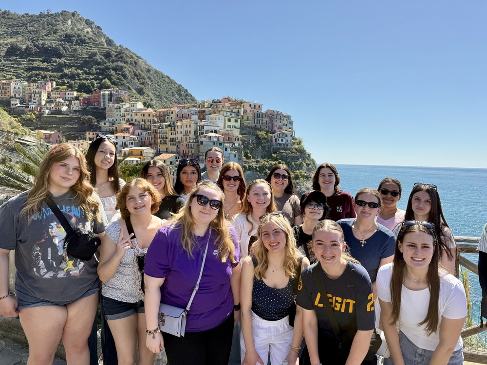 A group of girls posing in Italy.