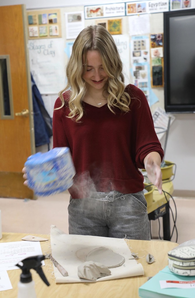 A HS student starting a ceramics project.