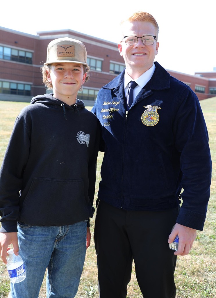 two boys posing for a photo.