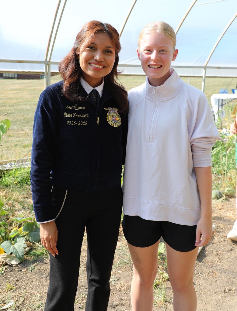 Two girls posing for a photo.