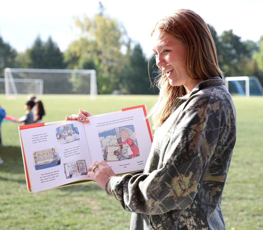 A high school girl reading a book. 