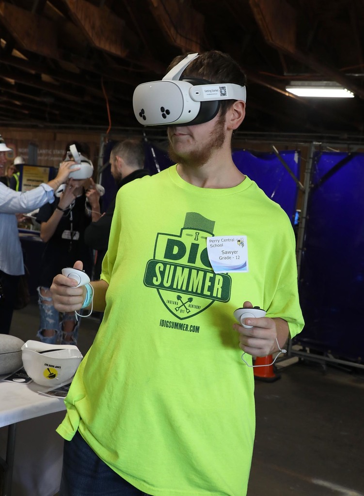 A high school boy wearing Virtual Reality goggles. 