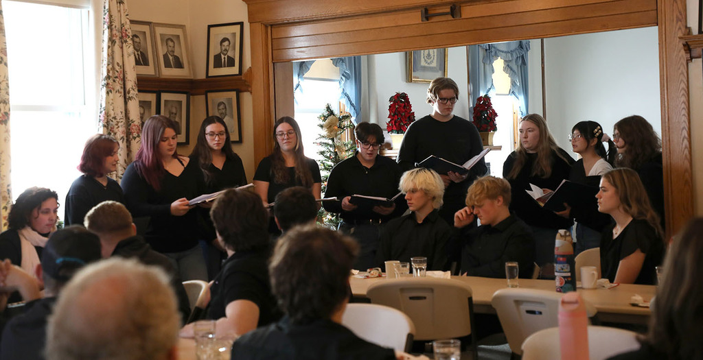 A high school select chorus performing at a Rotary meeting. 