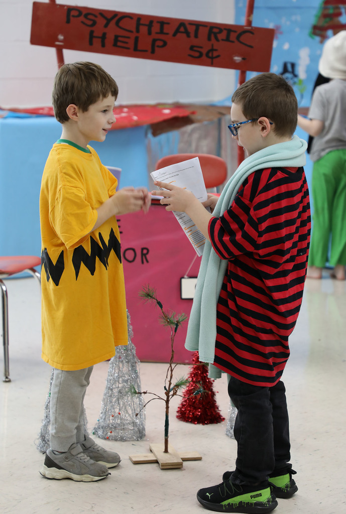Two elementary boys performing "A Charlie Brown Christmas." 