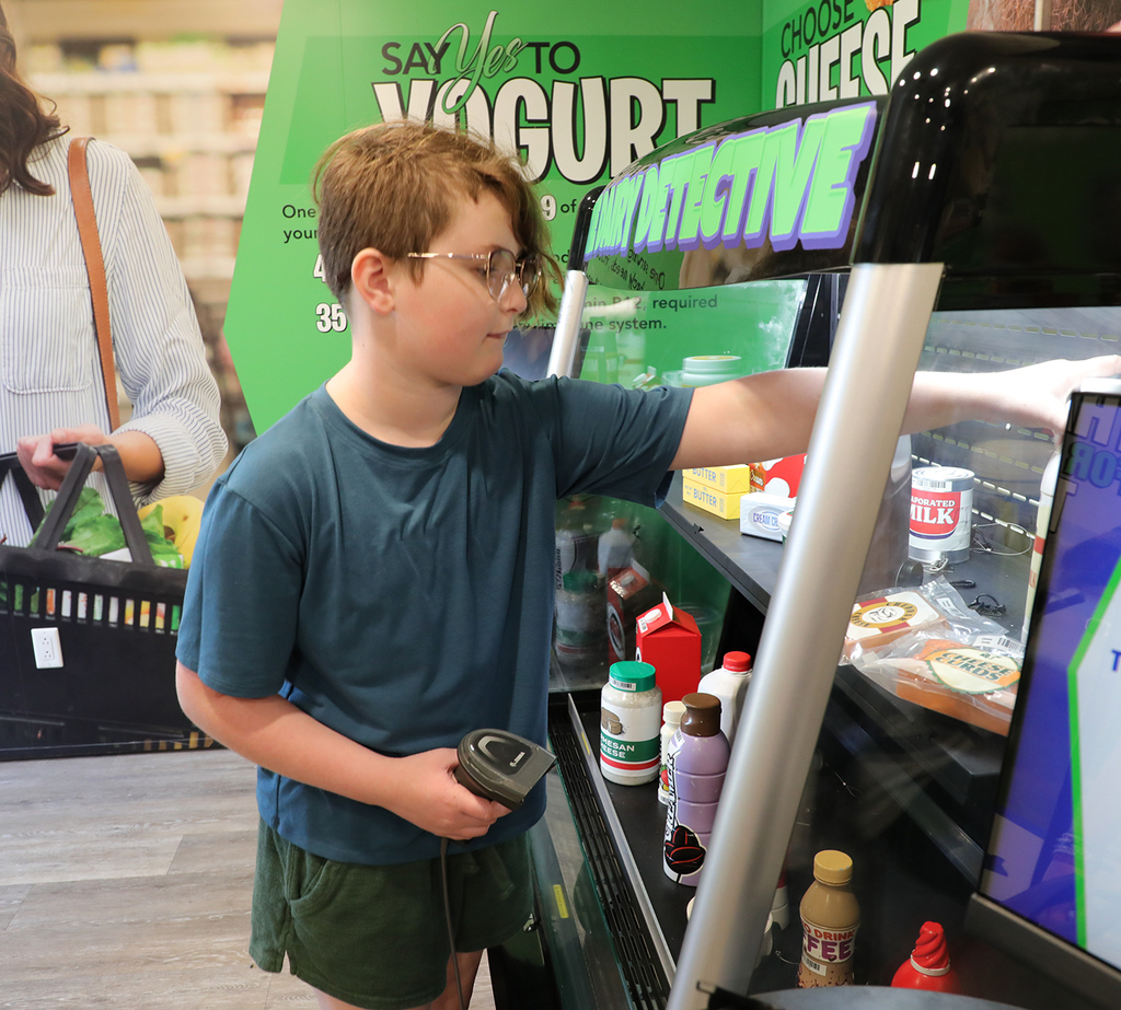 An elementary in a grocery store simulation. 