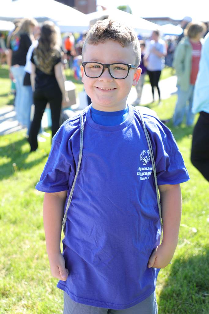 An elementary student smiling. 