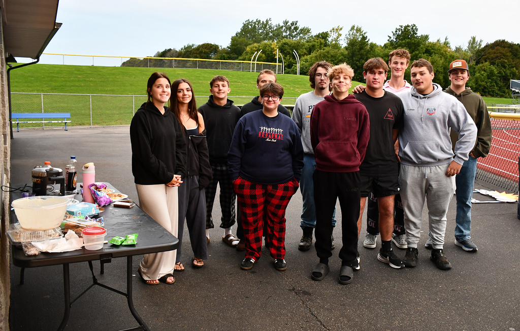 A group of seniors on a football field. 