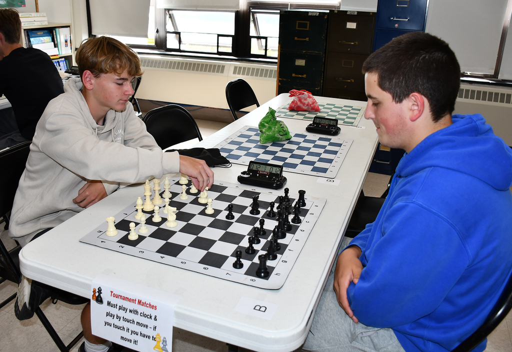 Two high school students playing chess. 