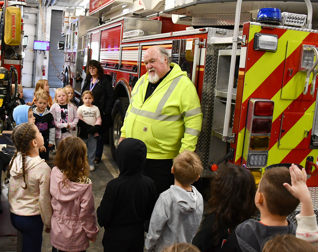 A group of students visiting a Fire Department.