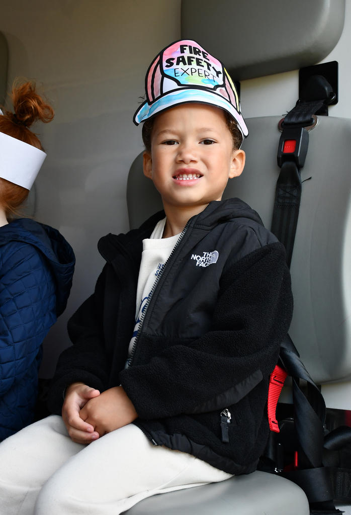 A young boy touring an ambulance. 