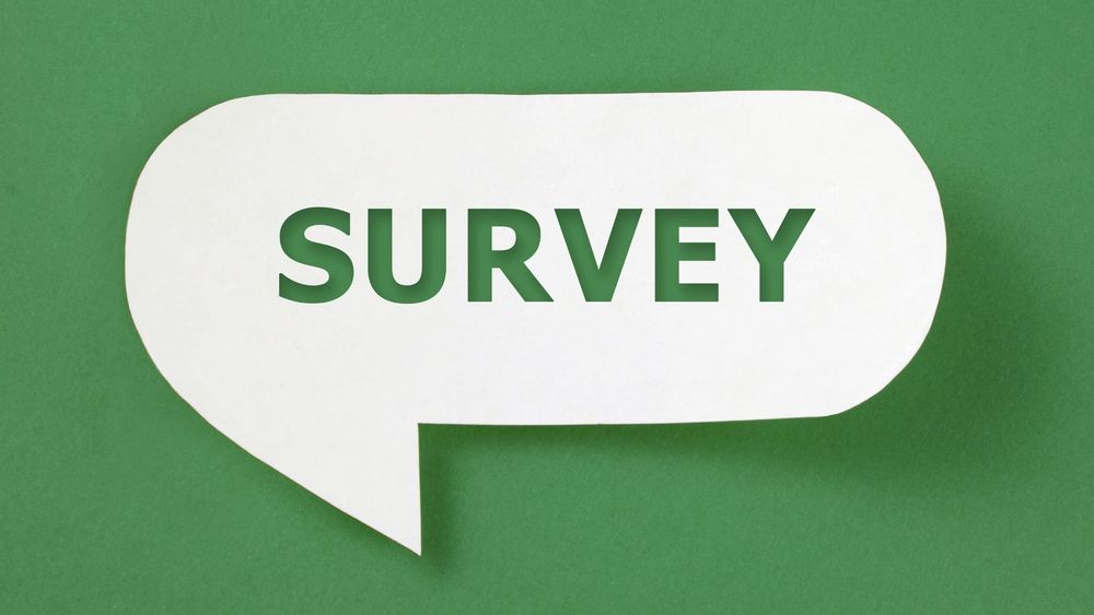The word "Survey" in a white speech bubble on a green background.
