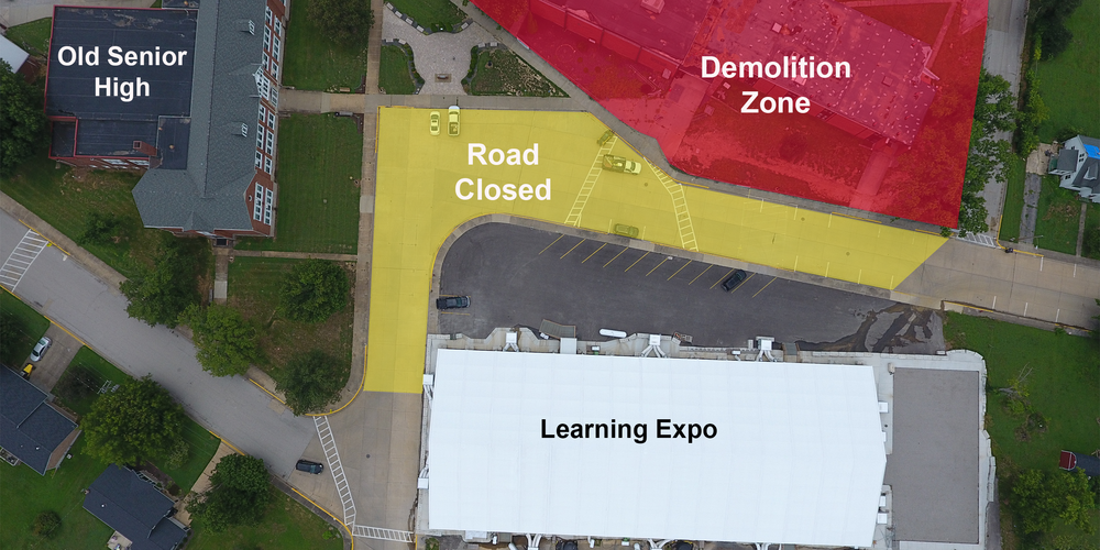 Drone image of the intersection of College and Edwards streets above Old Senior High, the Learning Expo, and Perryville High School. The area around PHS is shaded in red and labeled "Demolition Zone." The street is shaded yellow and labeled "Road Closed"