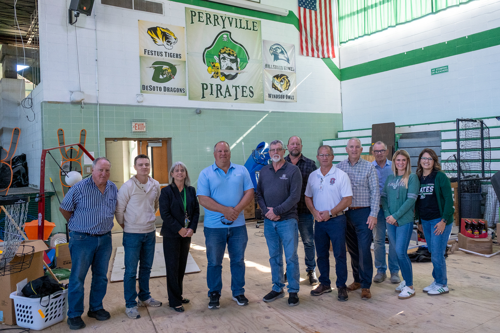Group photo taken in the PHS Gym. From left, Mayor Larry Riney, Representative Bryant Wolfin, Superintendent Dr. Fara Jones, County Commissioner Keith Hoehn, County Commissioner Mike Sauer, County Commissioner Jay Wengert, County Emergency Management Director Patrick Naeger, Representative John Voss, Senator Jamie Burger, COC Director of Operations/D32 Board Member Alex Lueders, COC Executive Director Renee Lottes.