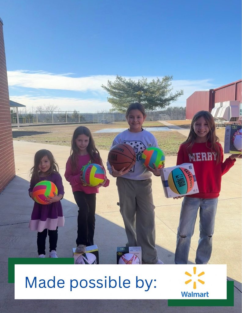 PES students pose with some playground balls that were purchased through a grant from Walmart.