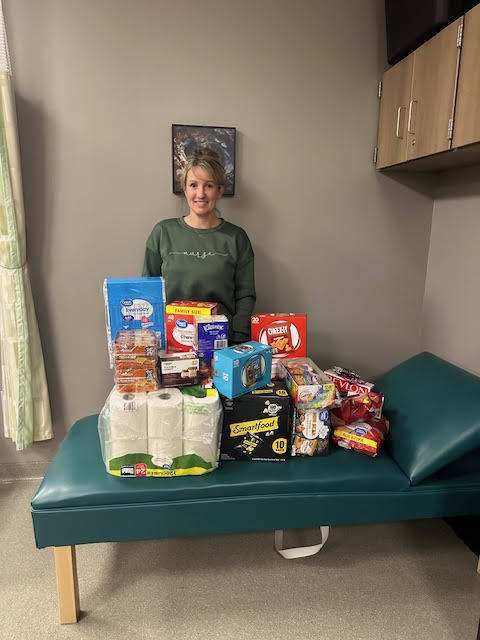 PCMS nurse Michelle Bollman is pictured with supples donated by Thrivent.