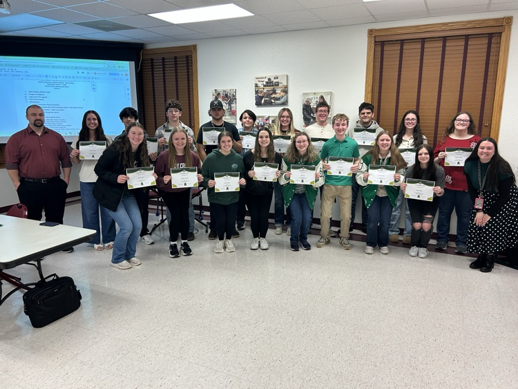 PHS band and choir students holding certificates 