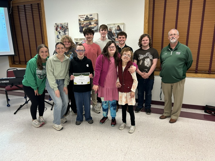 PHS students posing with a certificate 