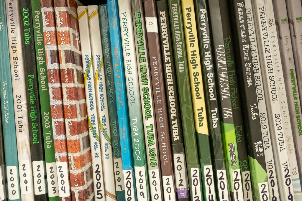 A closeup shot of a row of PHS yearbooks sitting on a shelf spanning several years from 2000 to 2021