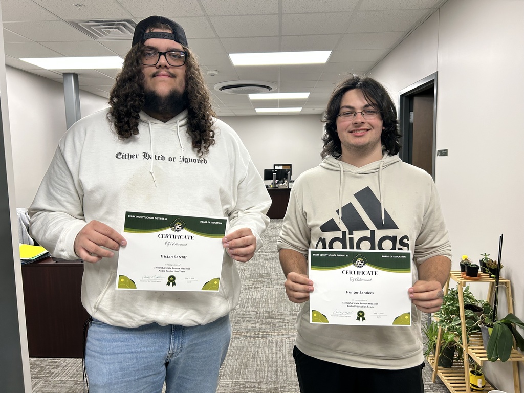 Hunder Sanders and Tristan Ratcliff hold certificates.
