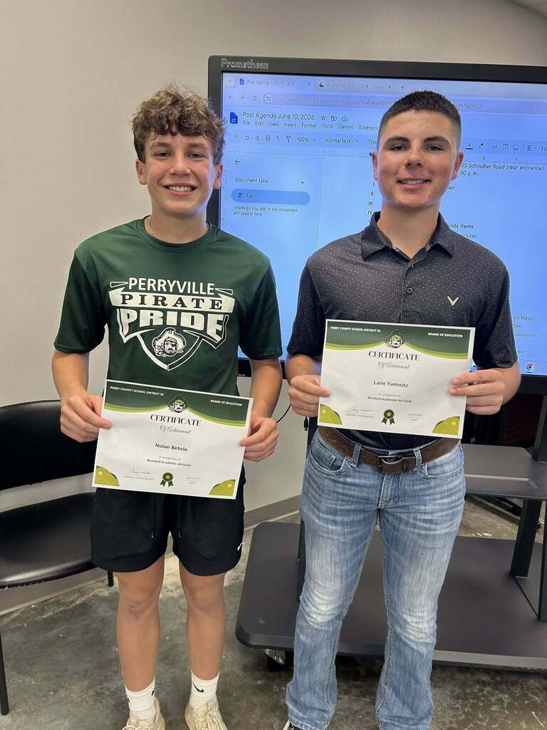 Nolan Behrle and Lane Yamitz stand holding certificates