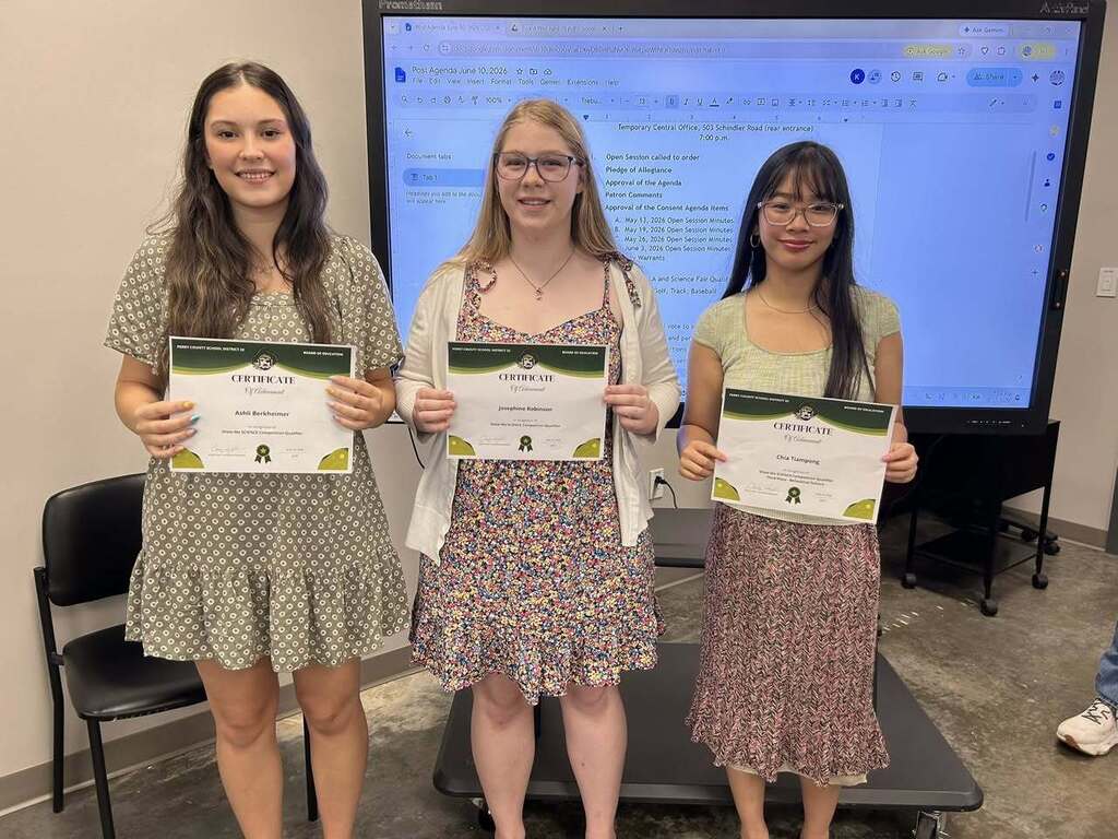 Ashli Berkheimer, Josie Robinson, and Chia Tiampong stand holding certificates.
