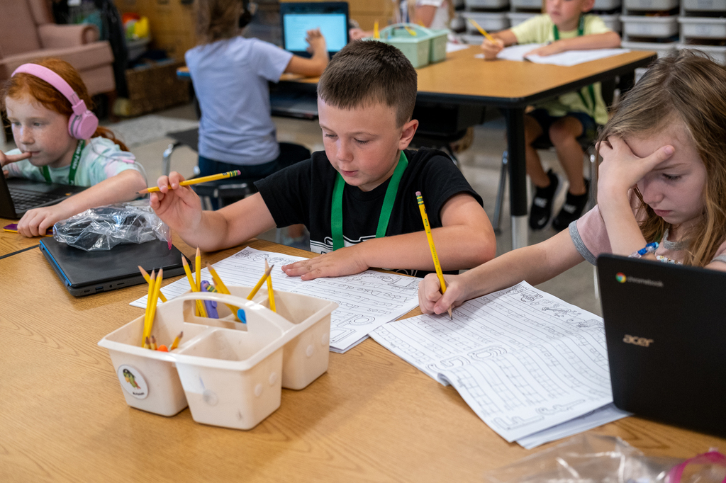 A student works on his handwriting.