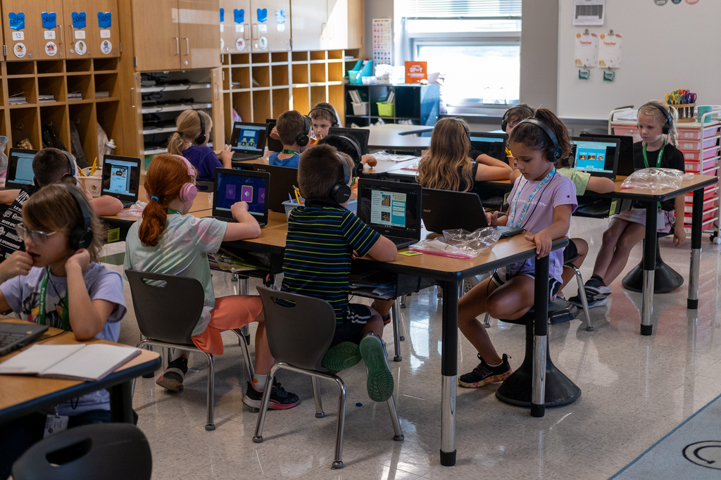 Students work on Chromebooks.