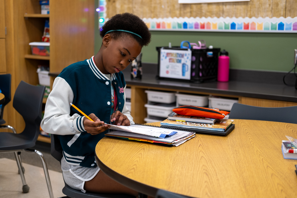 A student works on a worksheet.