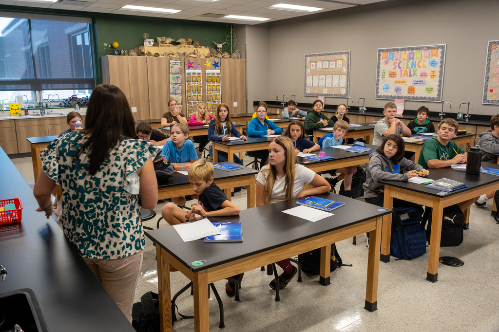 Students listening to their teacher.