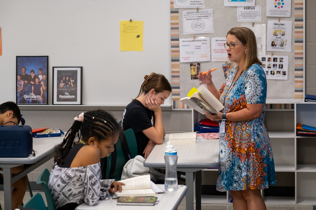 A teacher reads to her class.