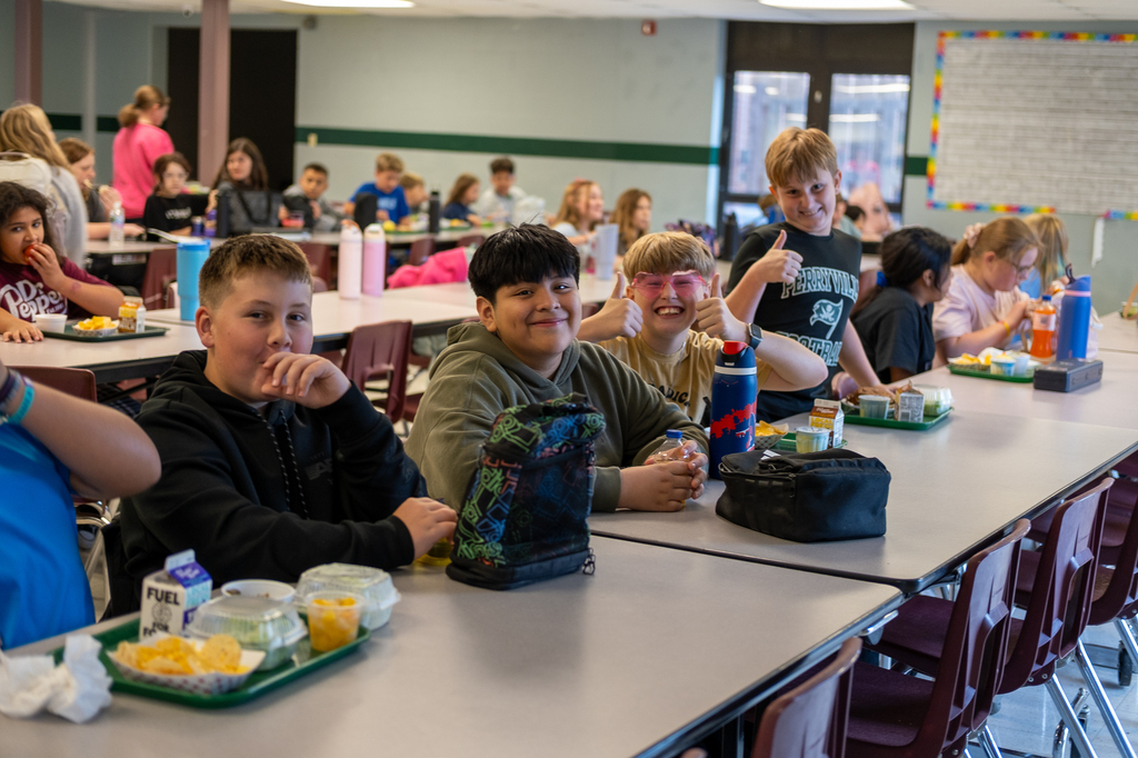 Students eat lunch in a cafeteria