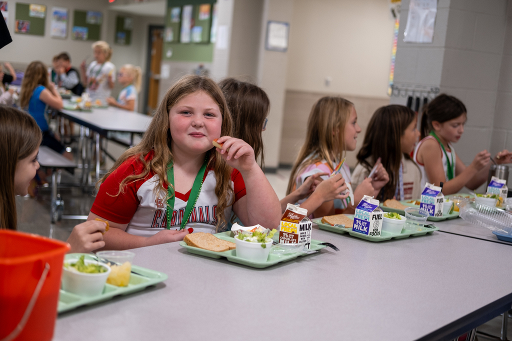 Students eat lunch in a cafeteria