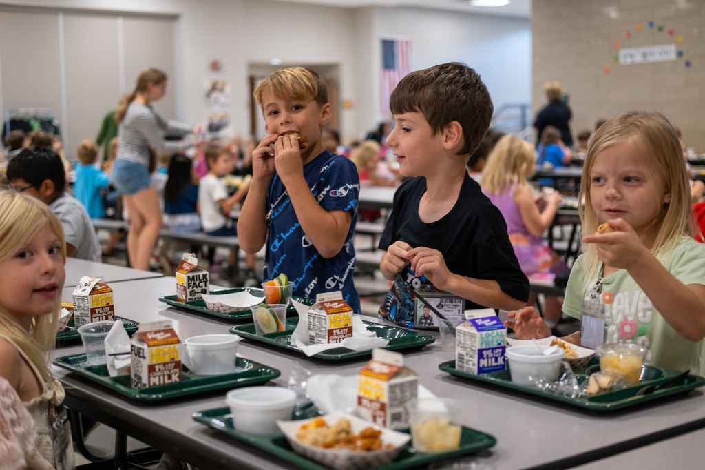 Students eat lunch in a cafeteria