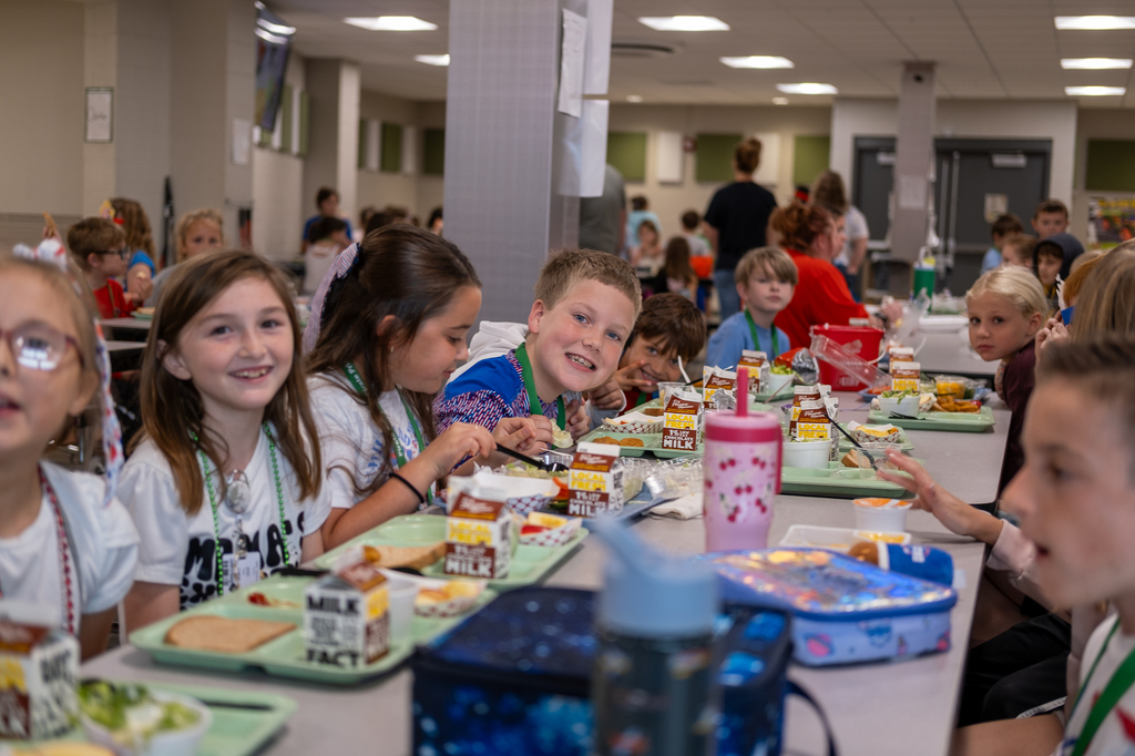Students eat lunch in a cafeteria