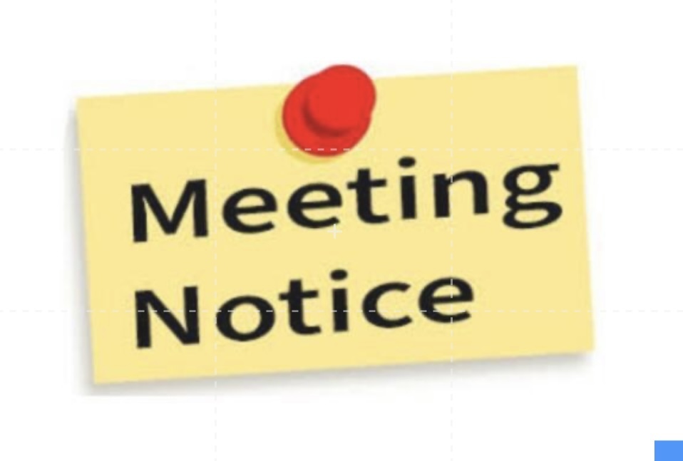 Yellow stick note with meeting notice 