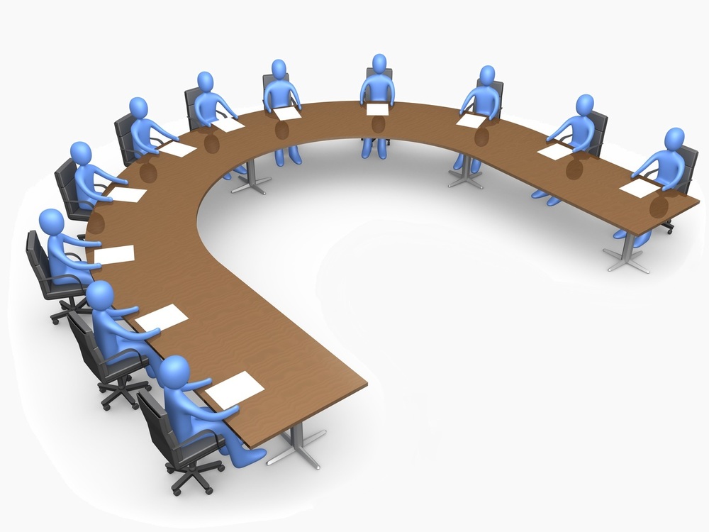 Blue character people seated around a u-shaped board table