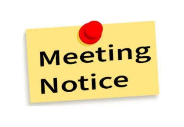 Sticky note with red push in  it with words meeting notice