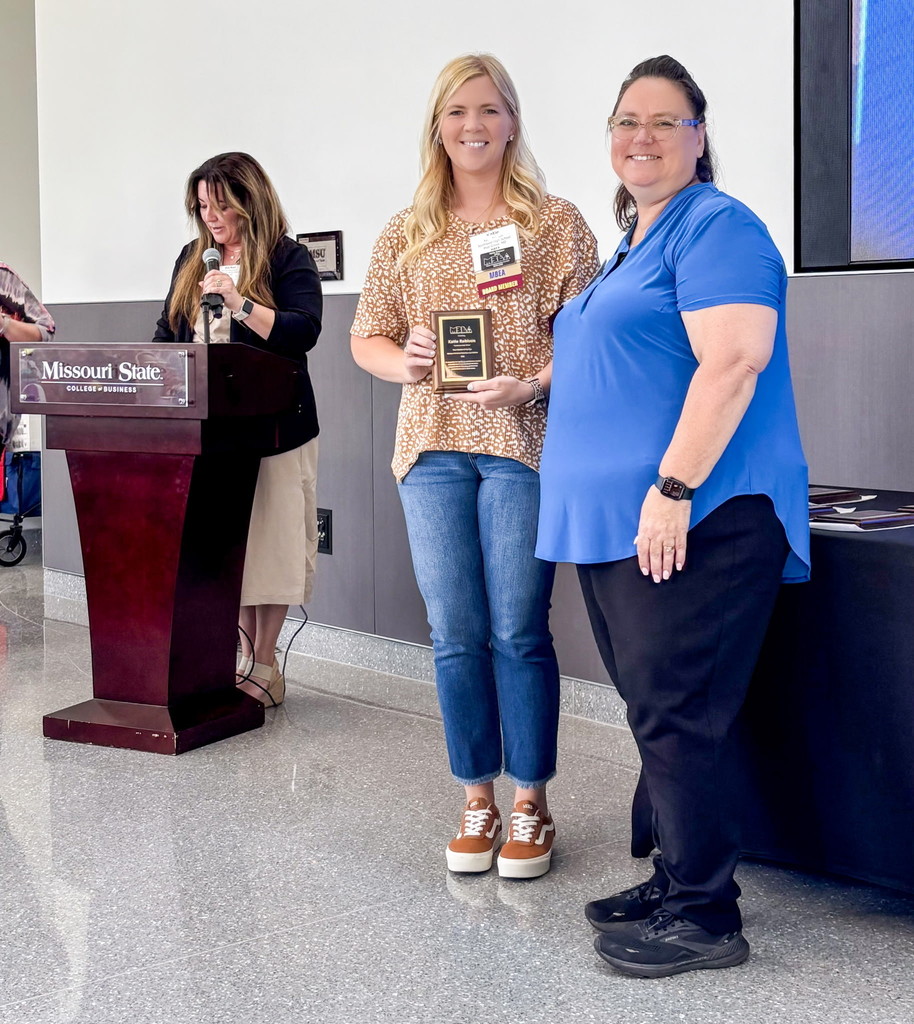 Katie Robison receiving the award