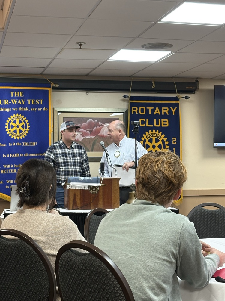 Tucker receiving Rotary award