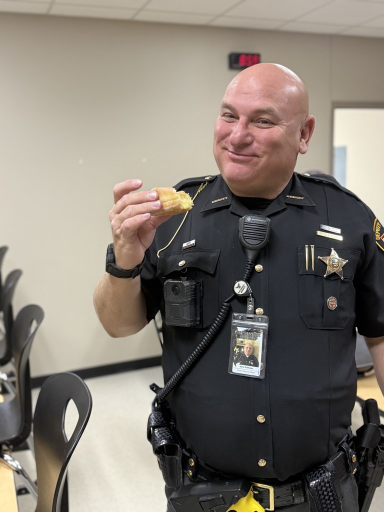 Officer Steve eating  a donut