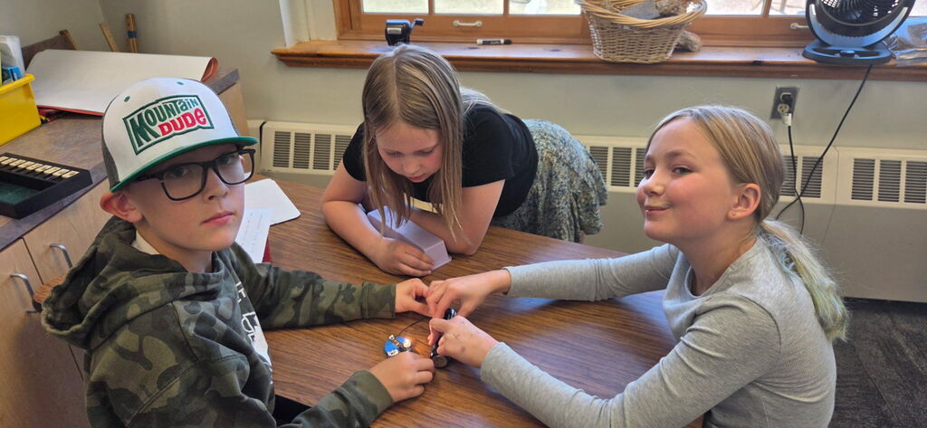 Working on their lightbulbs for Granny's flashlight.