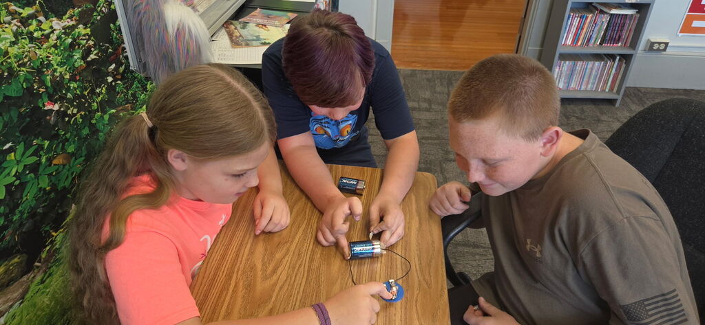 Working on their lightbulbs for Granny's flashlight.