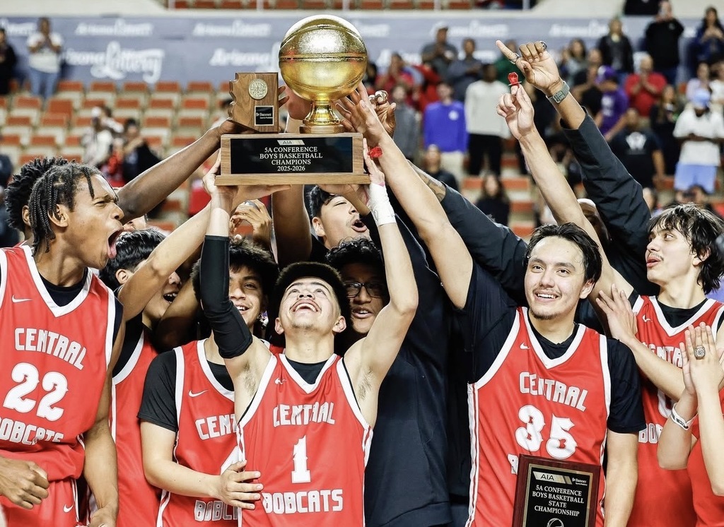 Central's basketball students lifting the Champioship trophy