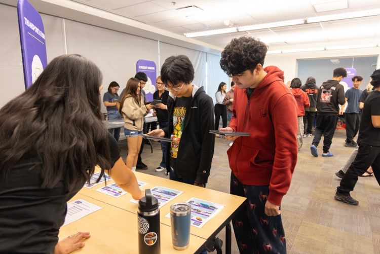 students being helped by adult