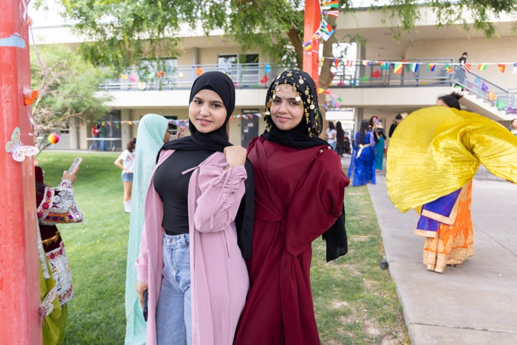 students posing for multicultural fashion show