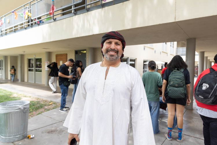 staff member posing for multicultural fashion show