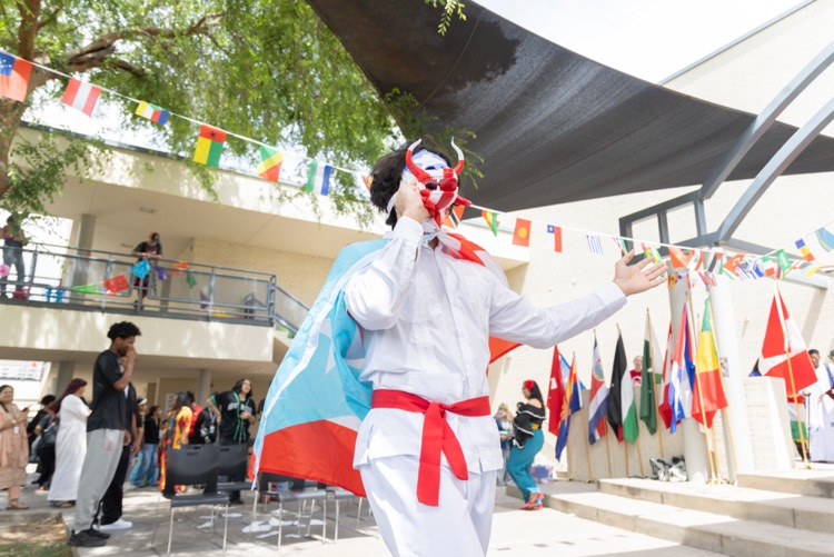 students posing for multicultural fashion show