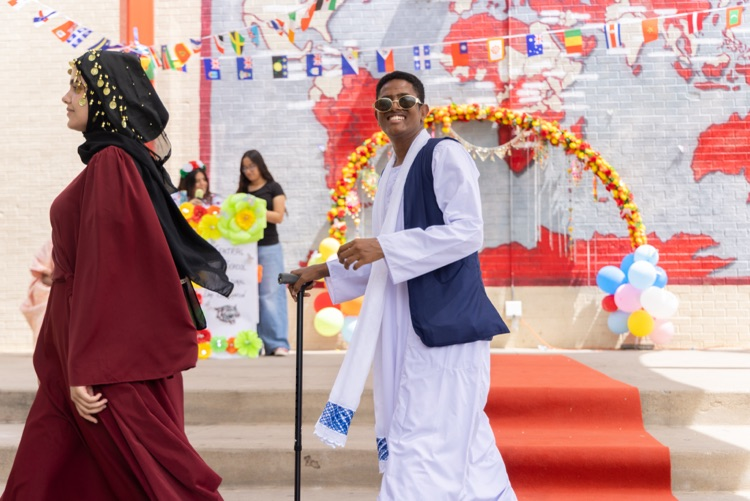 students posing for multicultural fashion show