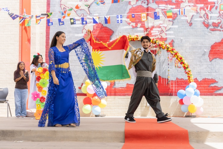 students posing for multicultural fashion show