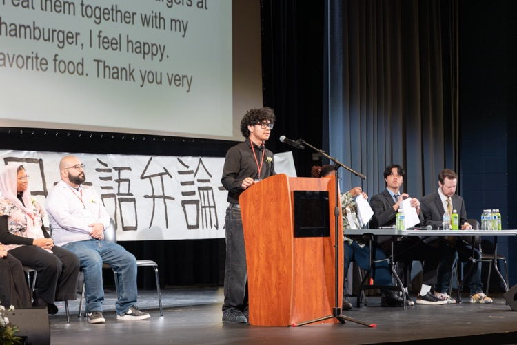 student at a podium reciting a speech